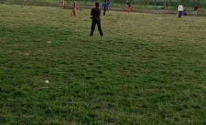 Youth playing cricket